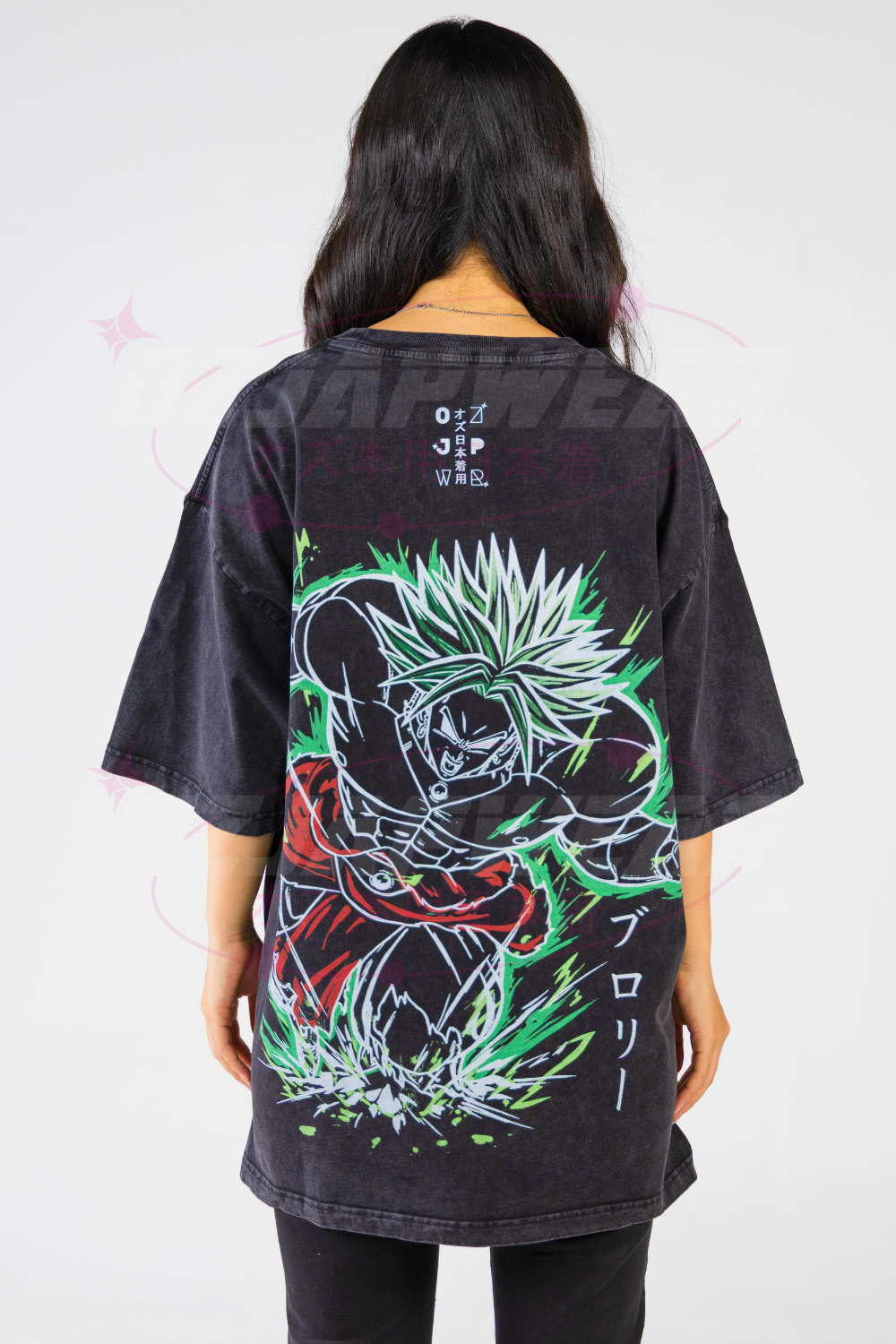 Back of black oversized tee featuring large neon green Broly artwork from Dragon Ball with energy aura.