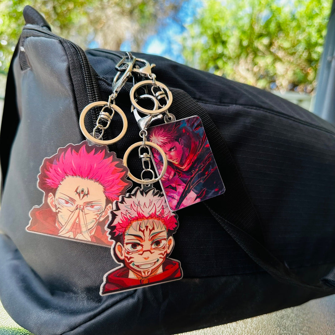 Unlock your inner sorcerer with our Jujutsu Kaisen Keychains | Here at OzJapWear we have the coolest Anime Clothing | Upgrade your style with our anime brand.