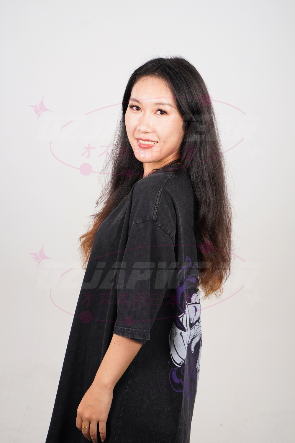 Side view of model wearing oversized Luffy Gear 5 anime tee with large back print.