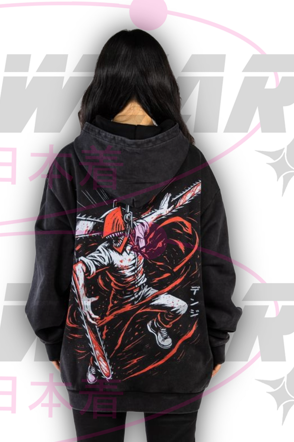 Back view of black oversized Denji Chainsaw Man hoodie by OzJapwear. Large dynamic Chainsaw Man artwork of Denji in action pose with chainsaws revving, red and orange blood splatter effects, Japanese text 'デンジ', worn by model showing full oversized length and hood up